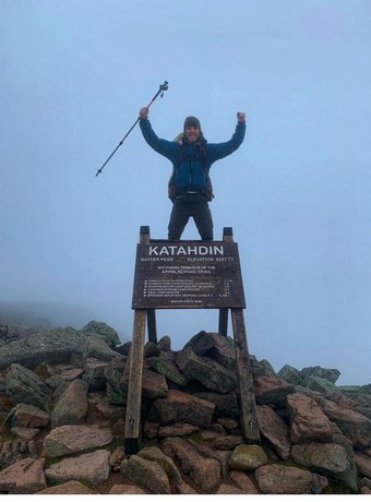 Andrew Veal at the Katahdin summit sign, northern terminus of the Appalachian Trail